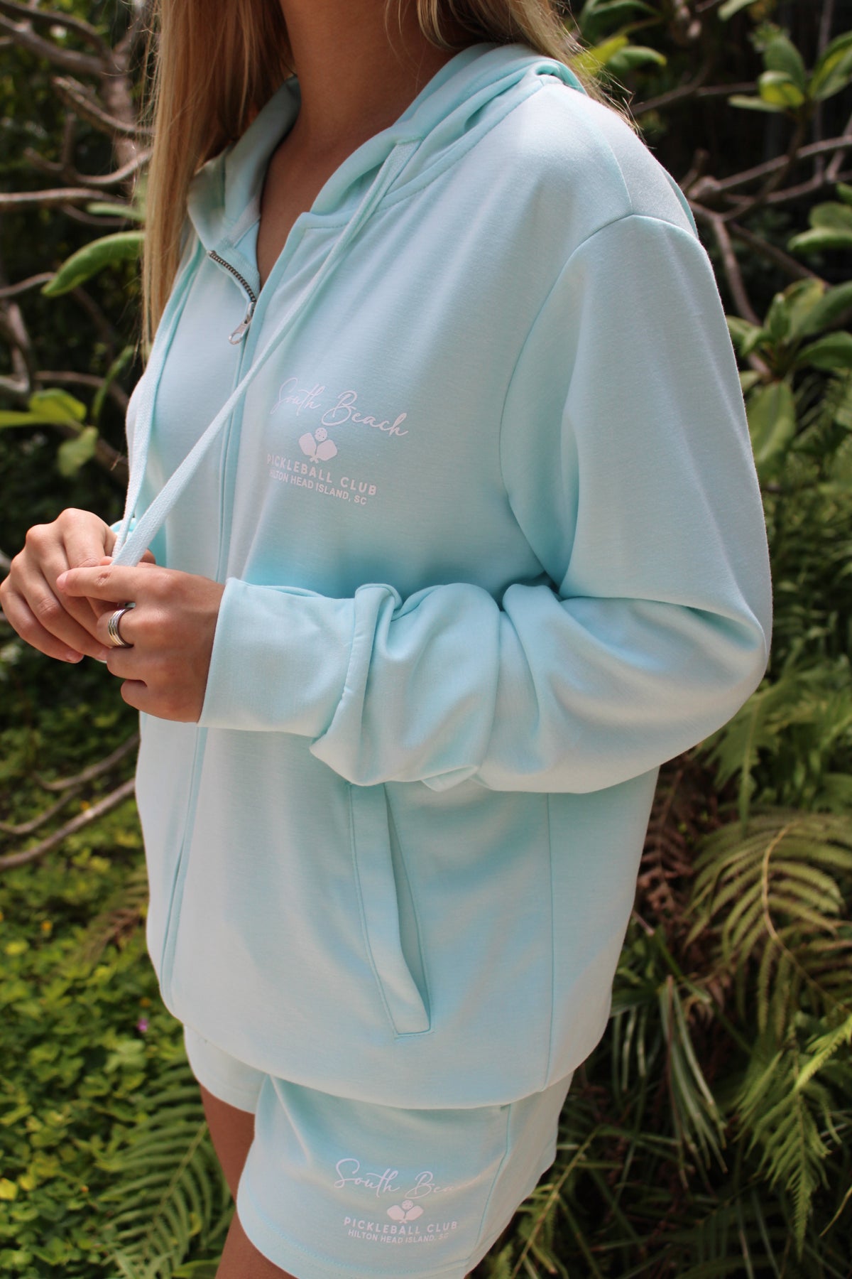 AQUA LIQUID ENERGY APPAREL HOODED ZIP SWEATSHIRT WITH WHITE SCREEN PRINT POCKET SOUTH BEACH PICKLEBALL CLUB LOGO